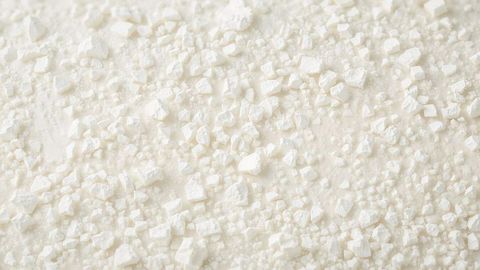 Scattered White Crystals on Smooth Surface