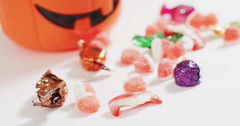 Assorted halloween candy with pumpkin shaped bucket