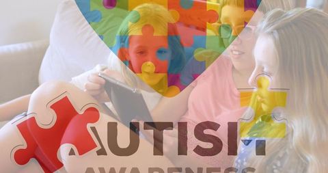 Three girls collaborating on tablet with autism awareness emblem