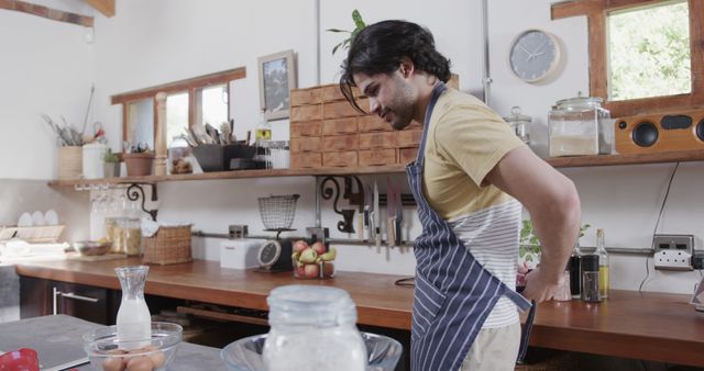 Young Man Preparing Food in Modern Kitchen - Download Free Stock Images Pikwizard.com