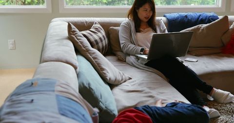 Mother and Son Using Laptop in Comfortable Living Room Setting - Download Free Stock Images Pikwizard.com