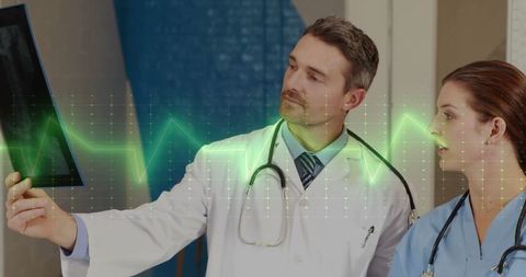 Doctors Reviewing X-ray with Digital Cardiograph Overlay - Download Free Stock Images Pikwizard.com