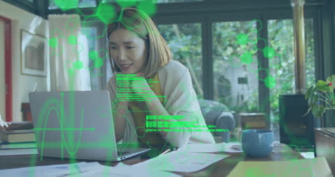 Businesswoman Analyzing Financial Data at Laptop with Holographic Interface