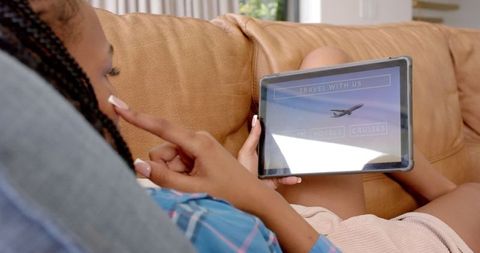 Young Woman Browsing Travel Options on Tablet at Home - Download Free Stock Images Pikwizard.com