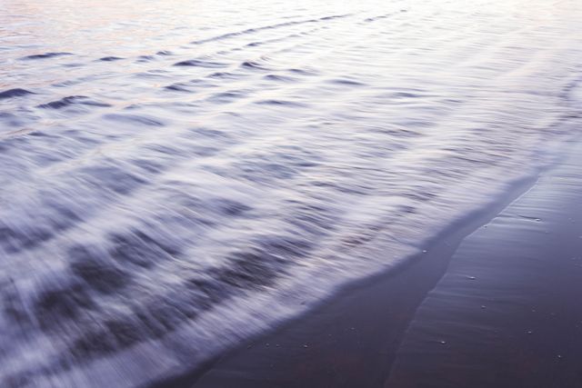 Calm Ocean Waves Gently Washing Ashore at Sunset - Download Free Stock Photos Pikwizard.com