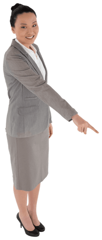 Smiling asian businesswoman pointing finger on transparent background