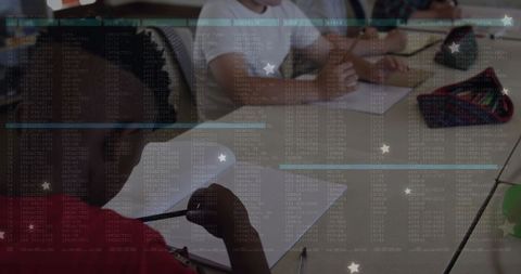 Diverse schoolchildren engaged in classroom writing activities