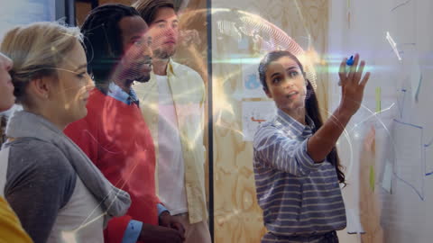 Diverse Team Collaborating with Tech Overlay in Modern Office