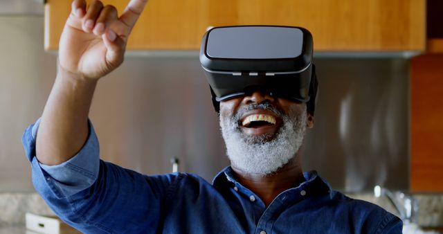 Happy Man with VR Headset Experiencing Virtual Reality at Home - Download Free Stock Images Pikwizard.com
