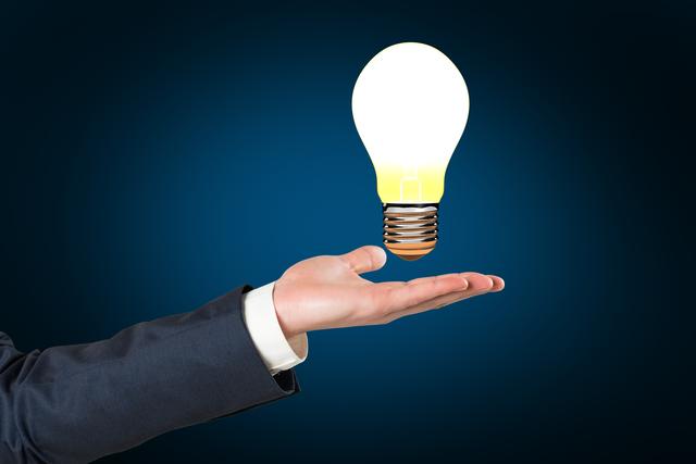 Hand holding light bulb  - Download Free Stock Photos Pikwizard.com