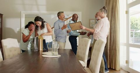 Diverse Friends Joyfully Celebrating at Indoor Gathering