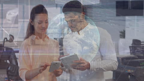 Diverse Business Professionals Analyzing Digital Data on Tablets