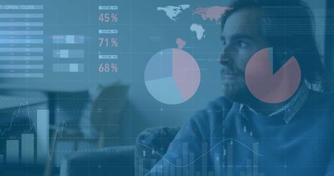 Businessman analyzing financial data with graphical interfaces