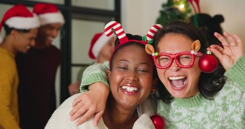 Diverse Female Colleagues Celebrating Holiday Season with Joyful Spirit
