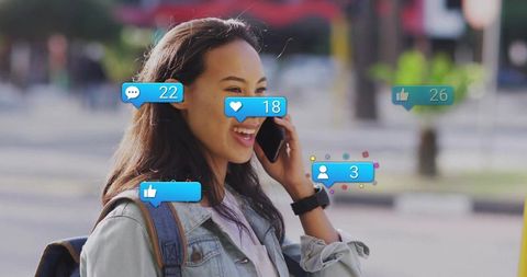 Woman Engaging with Social Media on Smartphone in Urban Setting