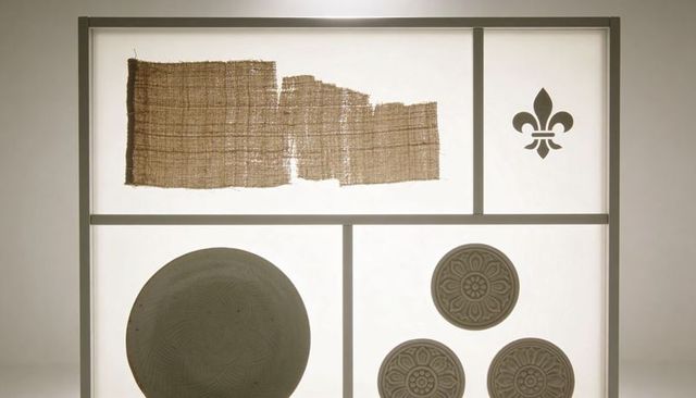 Backlit museum grid showing textile fragment, fleur-de-lis and rosette medallions