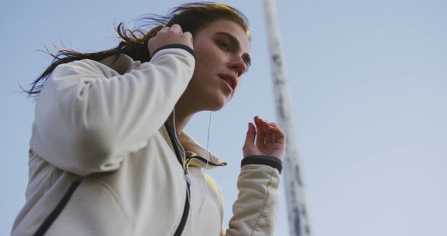 Woman Preparing for Workout Outdoors on Chilly Day - Download Free Stock Images Pikwizard.com