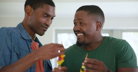 Cheerful Friends Preparing Healthy Vegetable Skewers Together