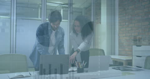 Business Colleagues Analyzing Financial Data in Modern Office