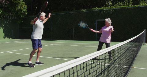 Active Senior Couple Playing Tennis on Sunny Day - Download Free Stock Images Pikwizard.com