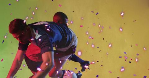 Rugby Players Celebrating Victory Amidst Colorful Confetti