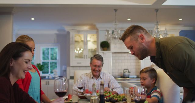 Family Enjoying Dinner Together in Bright Dining Room - Download Free Stock Images Pikwizard.com