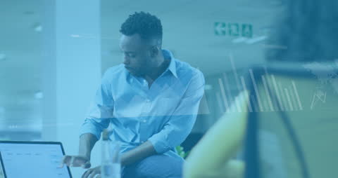 Business Professionals Analyzing Data in Modern Office Environment