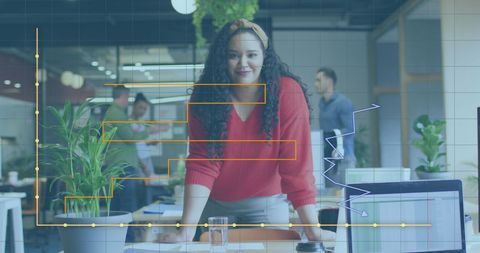 Successful Businesswoman Analyzing Financial Data in Modern Office