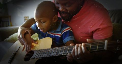 Father Teaching Son Guitar: Heartwarming Family Bonding Moment