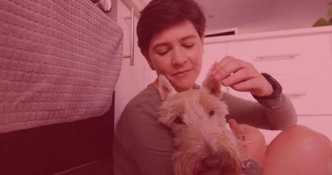 Woman Cuddling Terrier Dog on Bedroom Floor Promoting Comfort and Affection