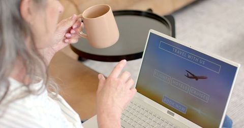 Mature Woman Booking Travel Online with Laptop and Coffee - Download Free Stock Images Pikwizard.com