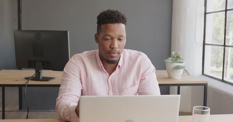 Man Having Video Conference Business Meeting on Laptop