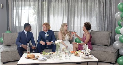 Joyous Indoor Wedding Reception with Friends Socializing