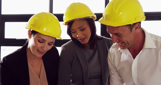 Diverse Professionals Collaborating with Hard Hats - Download Free Stock Images Pikwizard.com