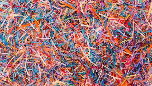 Bursting color multicolor shredded paper confetti texture background for creative design