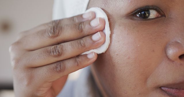 Close-up Woman Using Cotton Pad on Face for Skincare Routine - Download Free Stock Images Pikwizard.com