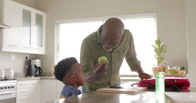 Grandfather Teaching Grandson Healthy Eating Habits in Modern Kitchen - Download Free Stock Images Pikwizard.com