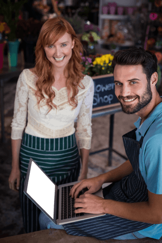 transparent smiling couple using laptop in flower shop - Download Free Stock Videos Pikwizard.com