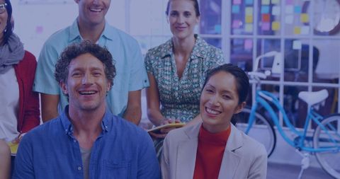 Collaborative Team Meeting in Modern Office with Smiling Colleagues