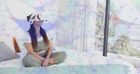 Woman Experiencing Virtual Reality Headset Comfortably Seated in Relaxed Atmosphere