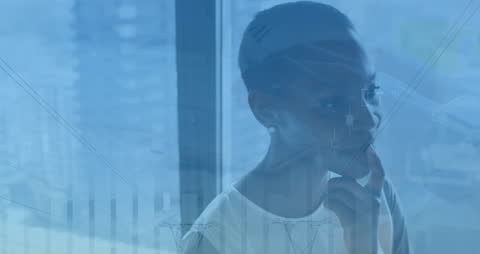 Forward-Thinking Businesswoman Overlaid with Financial Data and Charts