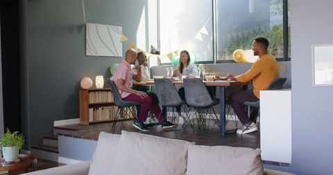 Multiracial Friends Celebrate Birthday at Home Meal Gathering