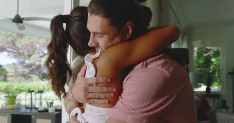 Couple sharing heartfelt moment in cozy home setting