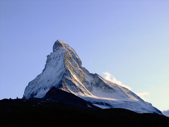 Snow-Covered Matterhorn Mountain at Sunrise with Clear Sky - Download Free Stock Photos Pikwizard.com