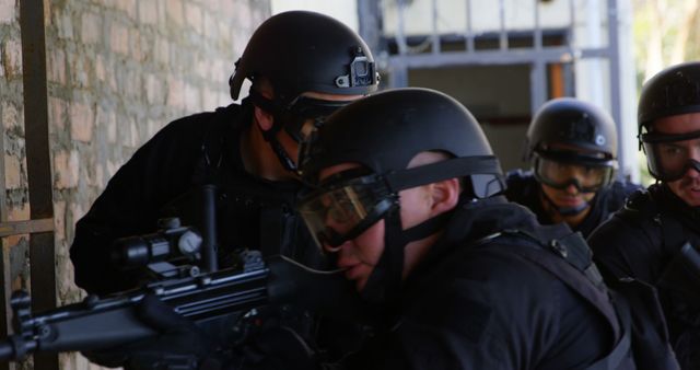 SWAT Team Members in Tactical Gear Preparing for Operation - Download Free Stock Images Pikwizard.com