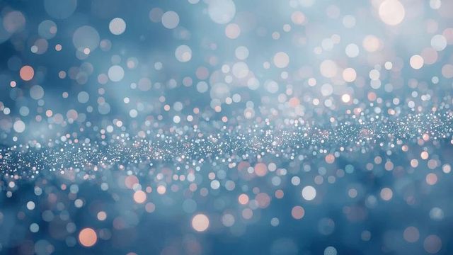Pastel Blue and Peach Bokeh Abstract with Shimmering Lights