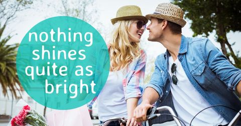 Couple on bicycle embracing love and adventure outdoors