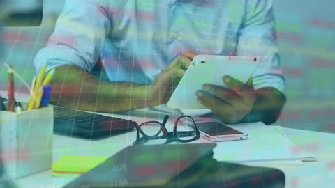 Business Professional Analyzing Financial Data on Tablet