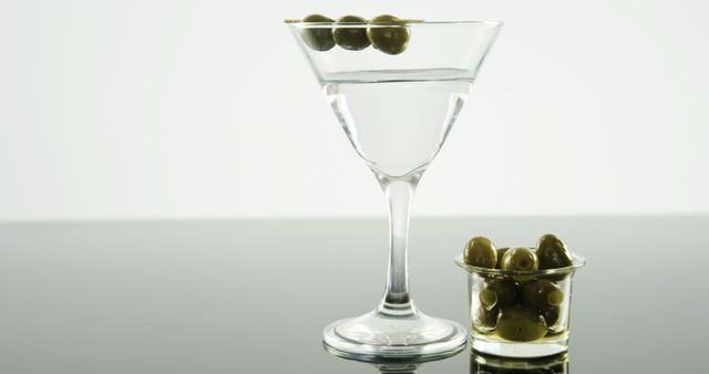 Elegant Martini Glass with Green Olives - Download Free Stock Images Pikwizard.com