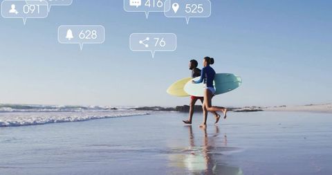 Surfers Running with Boards on Sunny Beach
